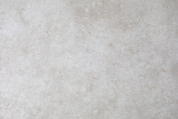 Textured pattern of a beige ceramic tile for a backdrop