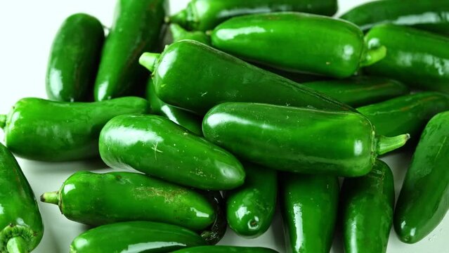green jalapeno chili pepper on white background food rotate footage