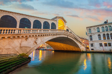 Panoramic view of famous Canal Grande with famous Rialto Bridge at sunset, Venice - 728270866