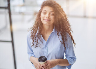 Young beautiful woman holding coffee paper cup