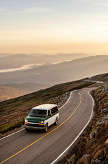 Car climbs mountain road with epic sweeping view, New Hampshire - obrazy, fototapety, plakaty