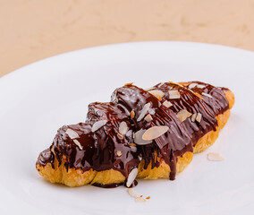 fresh baked croissant with chocolate and almonds