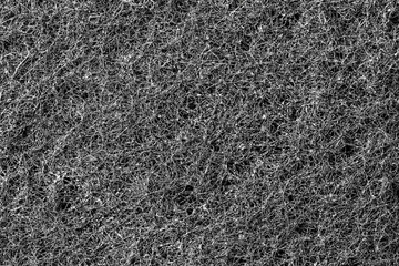 Dark abstract background and pattern of interwoven hairs, fibers and nanofibers. Sponge detail texture, sponge texture closeup background. Cellulose sponge texture. Black and white - obrazy, fototapety, plakaty