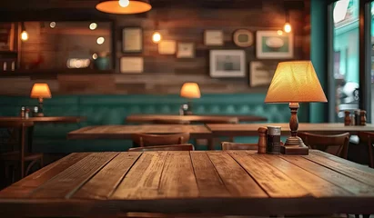 Deurstickers Empty wooden table in cafe with blurred background perfectly set for showcasing products in restaurant or bar environment table vintage design complements modern relaxed lifestyle of city pub © Thares2020
