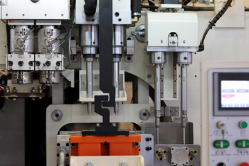 close up of plastic injection blow molding machine