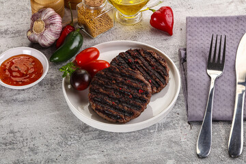 Grilled burger cutlet with sauce