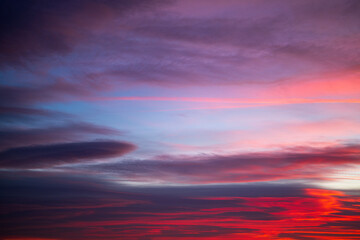 Dramatic clouds on a bright sunset sky. Natural background.