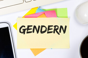 Gendern als Symbol für gendergerechte Sprache Kommunikation Konzept reden auf Schreibtisch