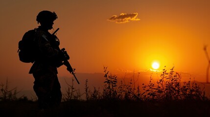 Fototapeta na wymiar American soldier silhouette during sunset