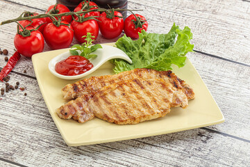 Grilled pork steak with ketchup