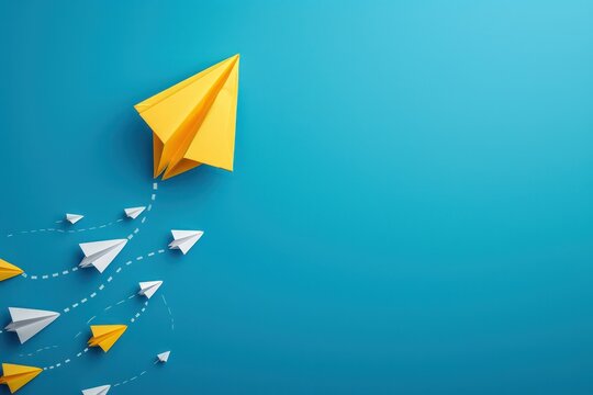 Change concepts with yellow paper boat leaving a dotted line on blue background leading among white airplane group stock photo 