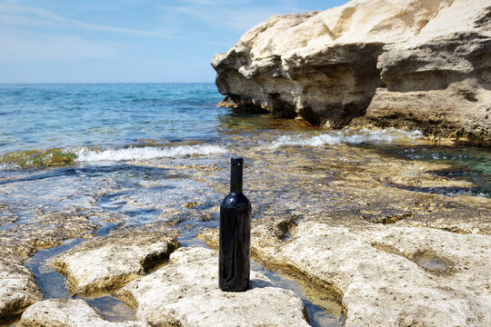 Bottle of wine on the shore.
