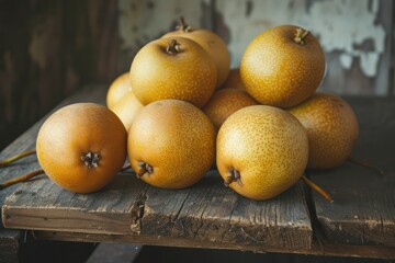 Low angle. Asian pears on old textured wooden table. 
