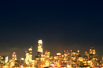 Fototapeta na wymiar Abstract blurry bokeh lights night city background with mock up place. Skyline and landing page concept.