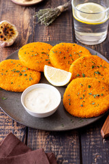 Fish cakes with white sauce and lemon. Seafood. Healthy eating.