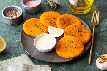 Fish cakes with white sauce and lemon. Seafood. Healthy eating.