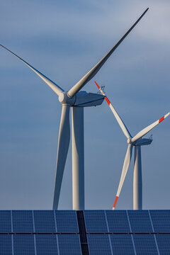 Solar panels and wind farm turbines