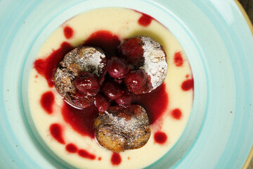 Poppy seeds bread pudding with cherry ragout and red wine