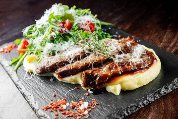 beef Cheeks In Demiglas Sauce with mashed potatoes and salad