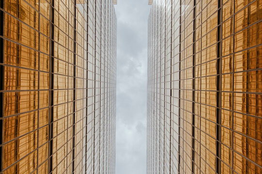 Golden glass buildings under sky at Hong Kong