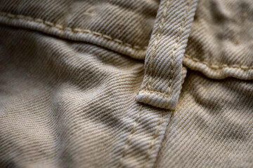 Close-up of denim texture, place for tucking in belt