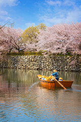 Himeji castle moat boat tour during full bloom cherry blossom in Hyogo, Japan - 728329090
