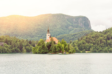 Slovenia, Upper Carniola, Bled, Summer sun setting over Bled island