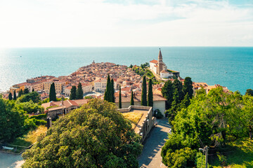 Slovenia, Coastal-Karst, Piran,View of coastal town in summer with clear line of horizon over Adriatic Sea in background