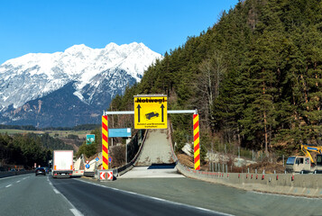 Road sign for Notweg - Runaway truck ramp in the forest on a mountain road, designed to slow down a...