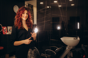 Portrait Of Female Stylist Or Business Owner In Hairdressing Salon