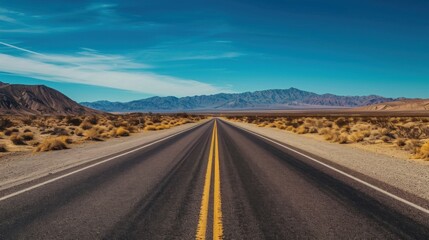 State Route 190 crossing Panamint Valley in Death Valley National Park, California, United States. Empty desert road in Death Valley