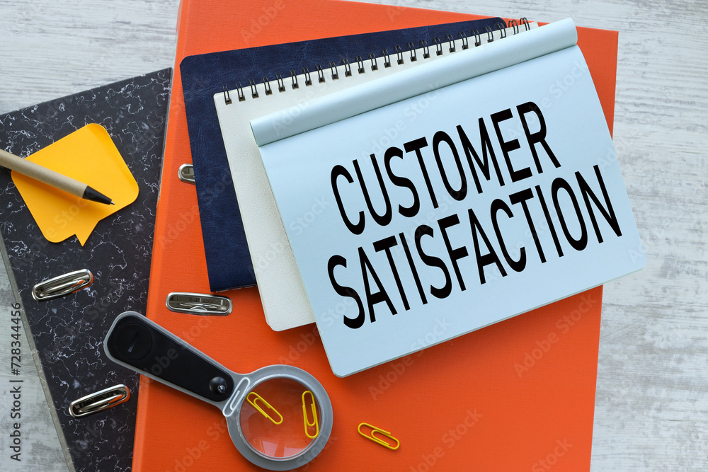 Poster customer satisfaction desktop orange folder calculator. text on a notebook