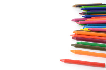 Crayons lined up isolated on white background.