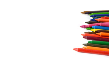 Crayons lined up isolated on white background.