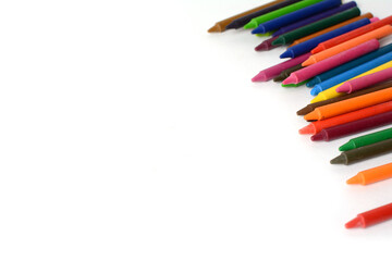 Crayons lined up isolated on white background.