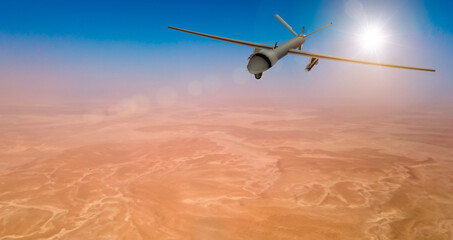Fototapeta na wymiar MQ military drone flying over desert on the Middle East