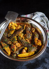 Koi Fish Curry with Seasonal Vegetables cooked in a traditional Bengali style