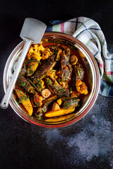 Koi Fish Curry with Seasonal Vegetables cooked in a traditional Bengali style
