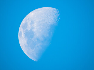 Blue daytime moon in the third quarter phase
