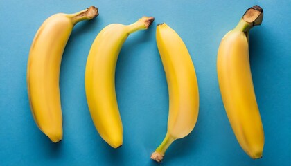 top view of fresh yellow bananas on blue background