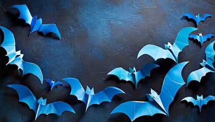 halloween photo of blue paper bats on blank dark blue background