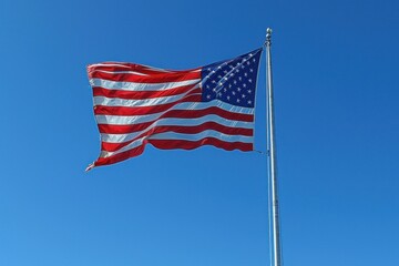 Fototapeta premium American flag on blue sky background