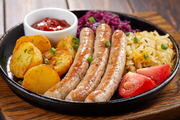 sausages with baked potato and cabbage
