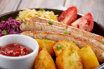 sausages with baked potato and cabbage