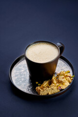 Coffee with halva on a gray background