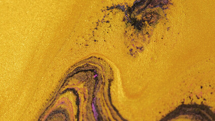 Obraz premium Glitter ink texture. Paint flow. Defocused golden yellow black color shimmering particles fluid mix wave motion decorative abstract art background.