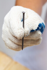 man with nail and hammer