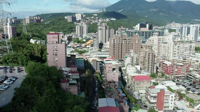 Aerial View of Guandu Hospital and Surrounding Taipei Cityscape and Mountains
