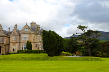 Fototapeta premium Muckross House was a stately residence and castle-like mansion and is located south of the Irish town of Killarney