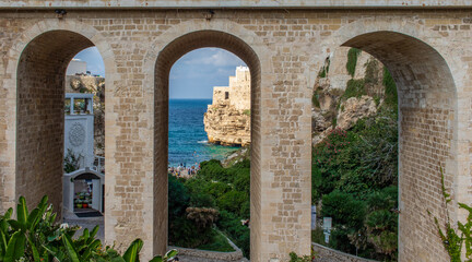 Fototapeta na wymiar Polignano a Mare, Italy - one of the most beautiful cities on the Adriatic Sea, Polignano a Mare is a main landmark in Apulia. Here in particular the Bourbon Bridge
